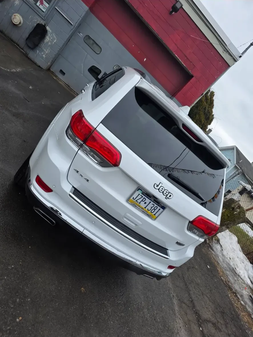 After: rear of the white Jeep clean and glossy