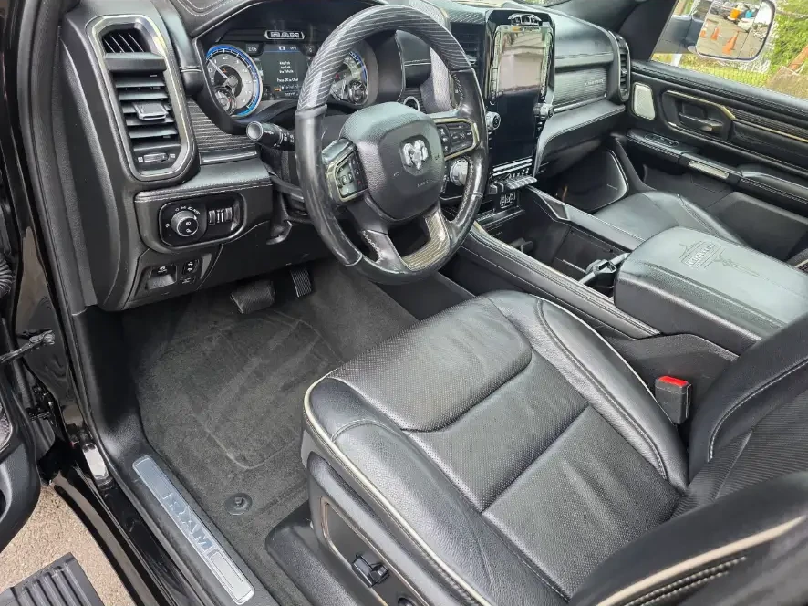 After: Ram driver area with clean carpet, dash and leather seat